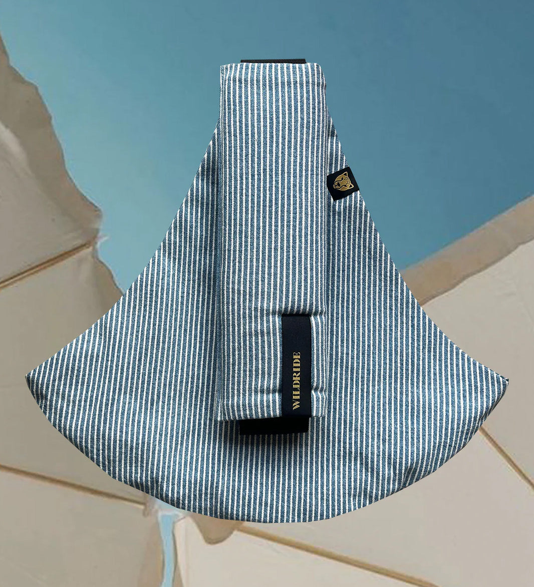 Wildride toddler carrier in denim stripe. A 100% cotton seat stylish hip carrier for babies in thin blue and white stripes 