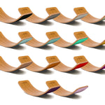 Full range of Wobbel Bamboo balance boards laid out on a white background