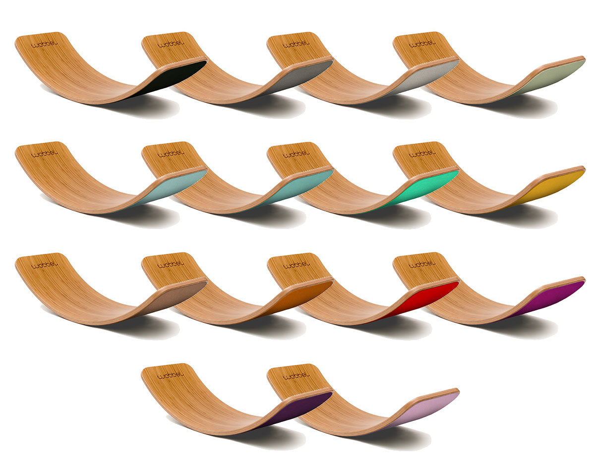 Full range of Wobbel Bamboo balance boards laid out on a white background