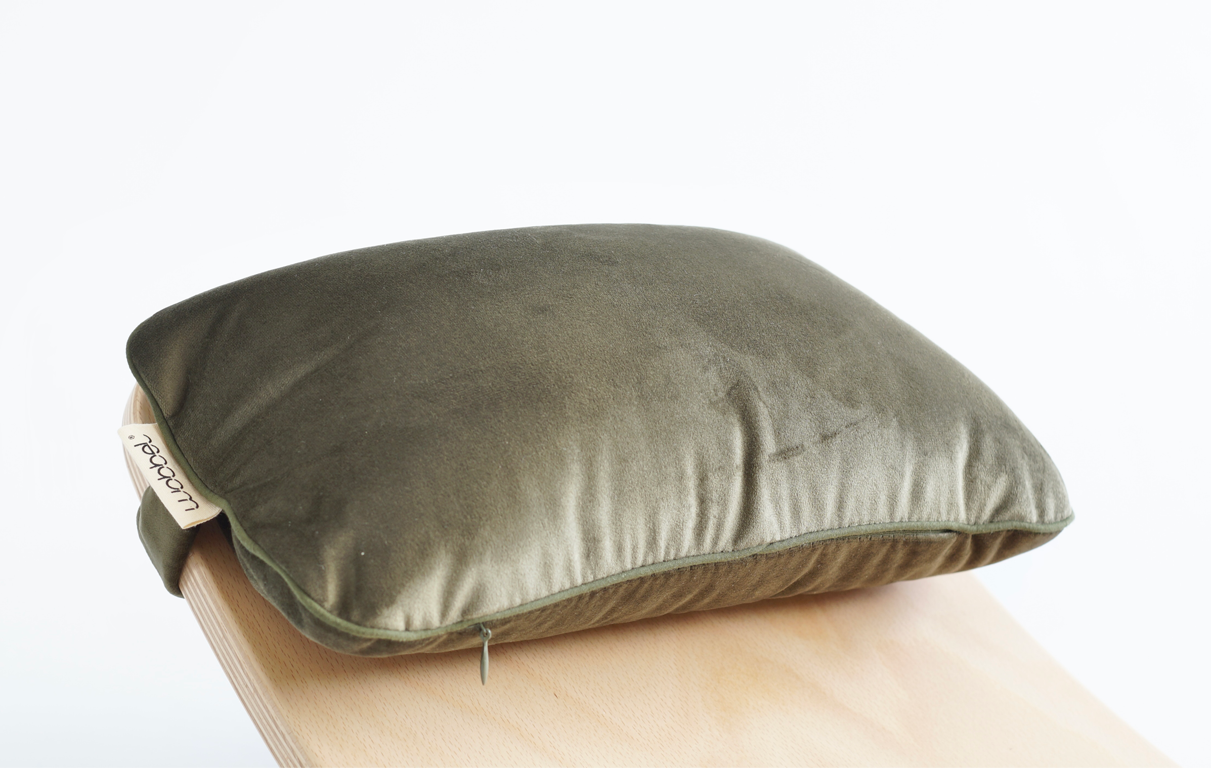 The Extra Large Wobbel Board pillow accessory in velvety aventurine green, made from organic cotton.