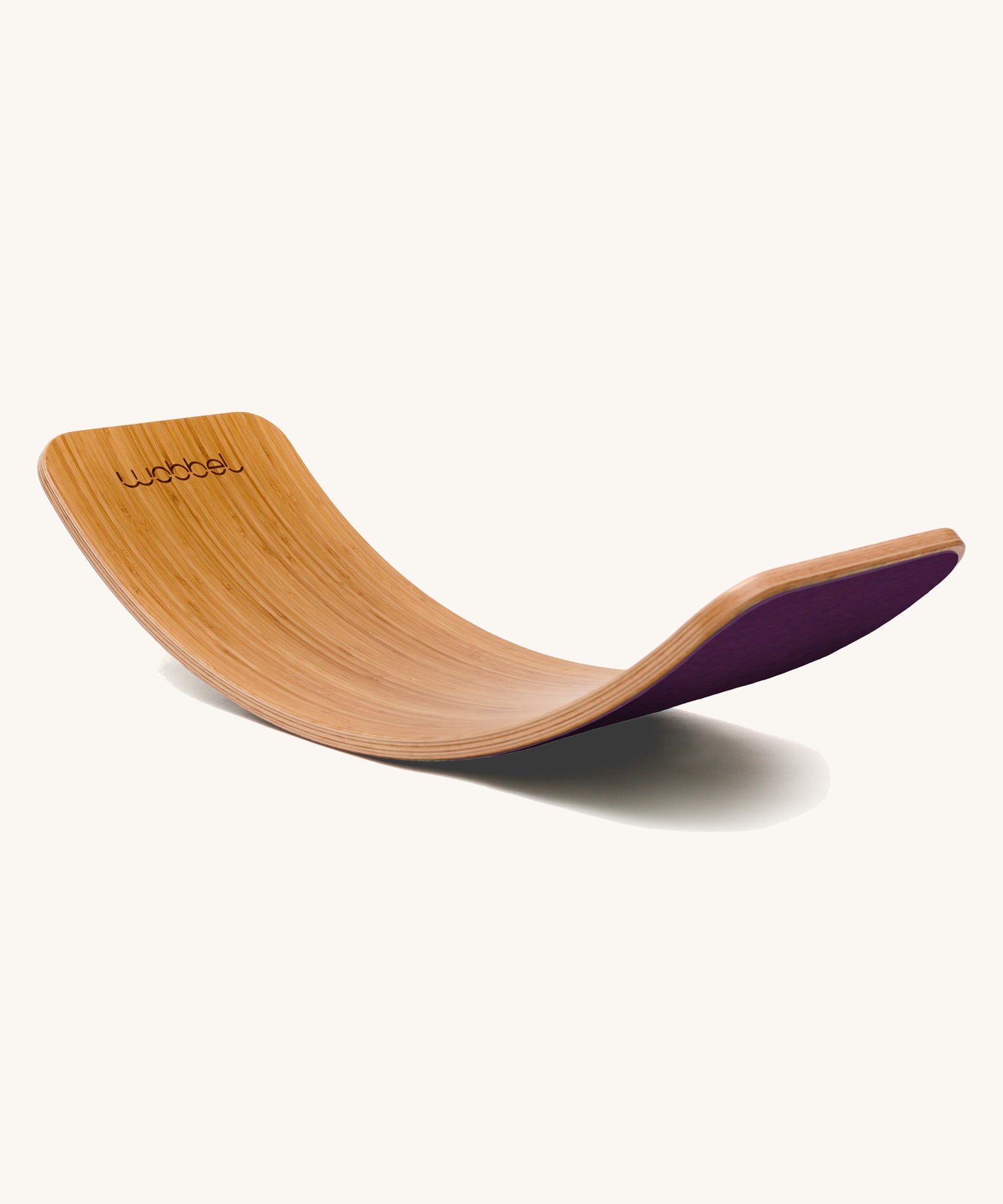 Wobbel Original bamboo balance board with aubergine wool felt backing shown side-on.