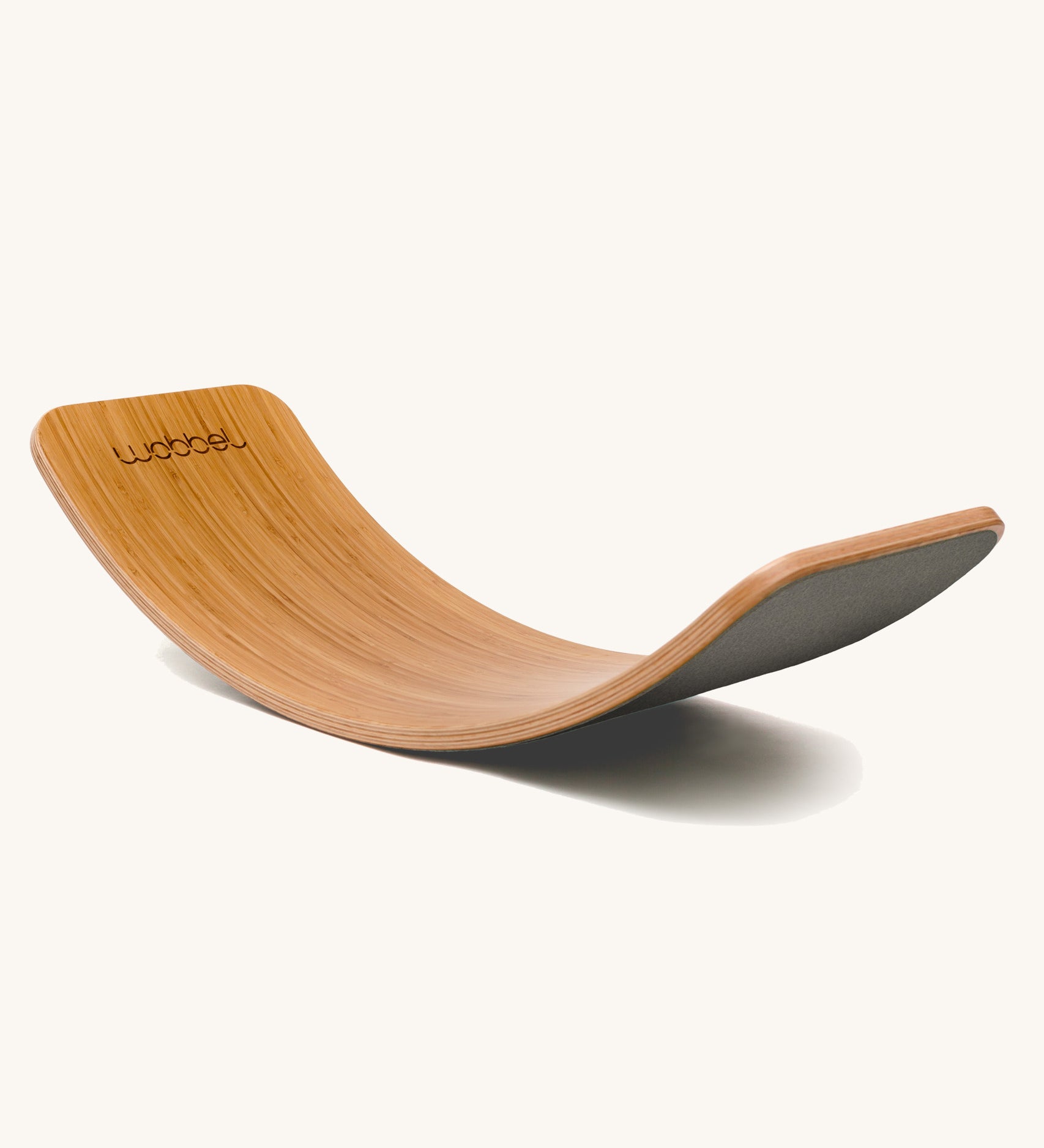 Wobbel Original bamboo balance board with mouse grey wool felt backing displayed side-on.