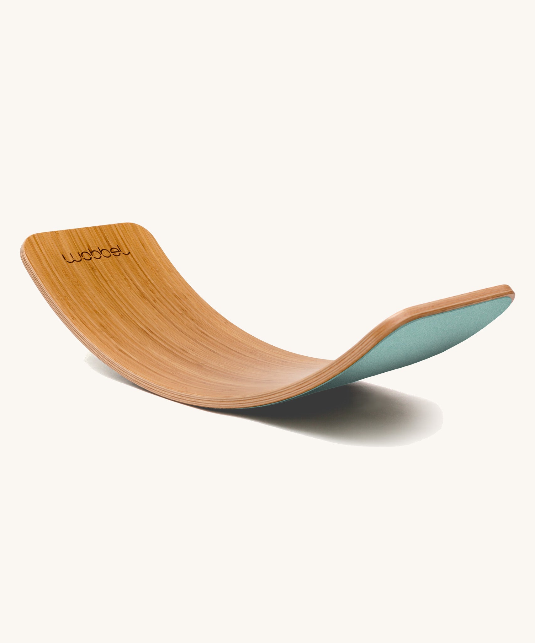 Wobbel Original bamboo balance board with sky blue wool felt backing shown in a curved side profile.