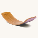 Wobbel Original bamboo balance board with wild rose wool felt base displayed on plain background.