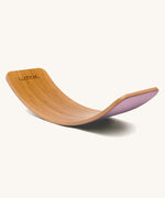 Wobbel Original bamboo balance board with wild rose wool felt base displayed on plain background.