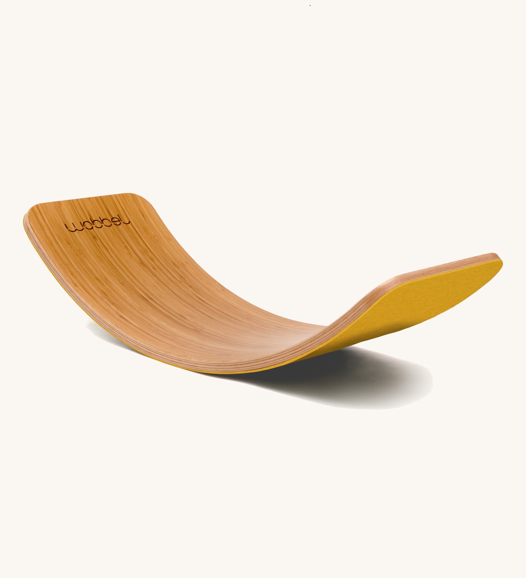 Wobbel Original bamboo balance board with yellow natural wool felt backing shown in arch position.