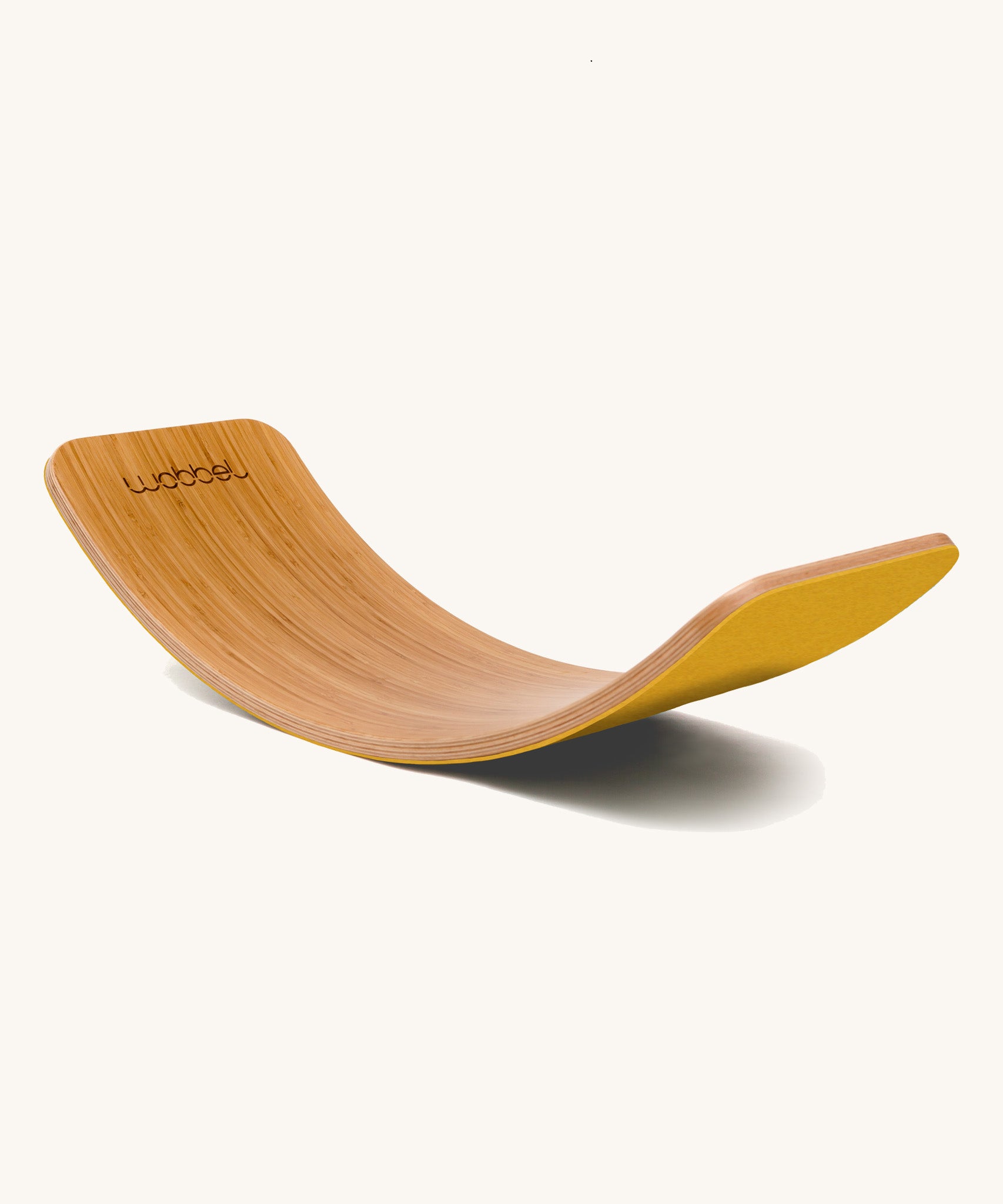 Wobbel Original bamboo balance board with yellow natural wool felt backing shown in arch position.