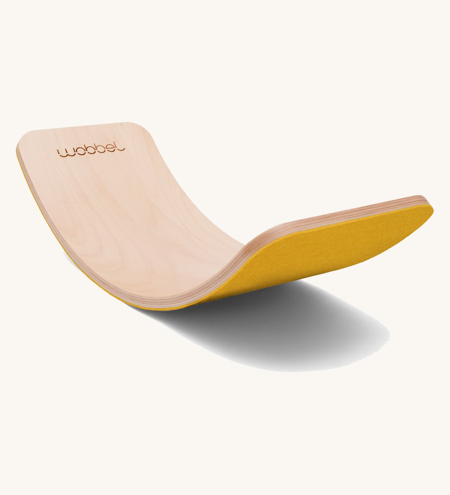 Wobbel Original beech balance board with mustard recycled felt base displayed in curved profile