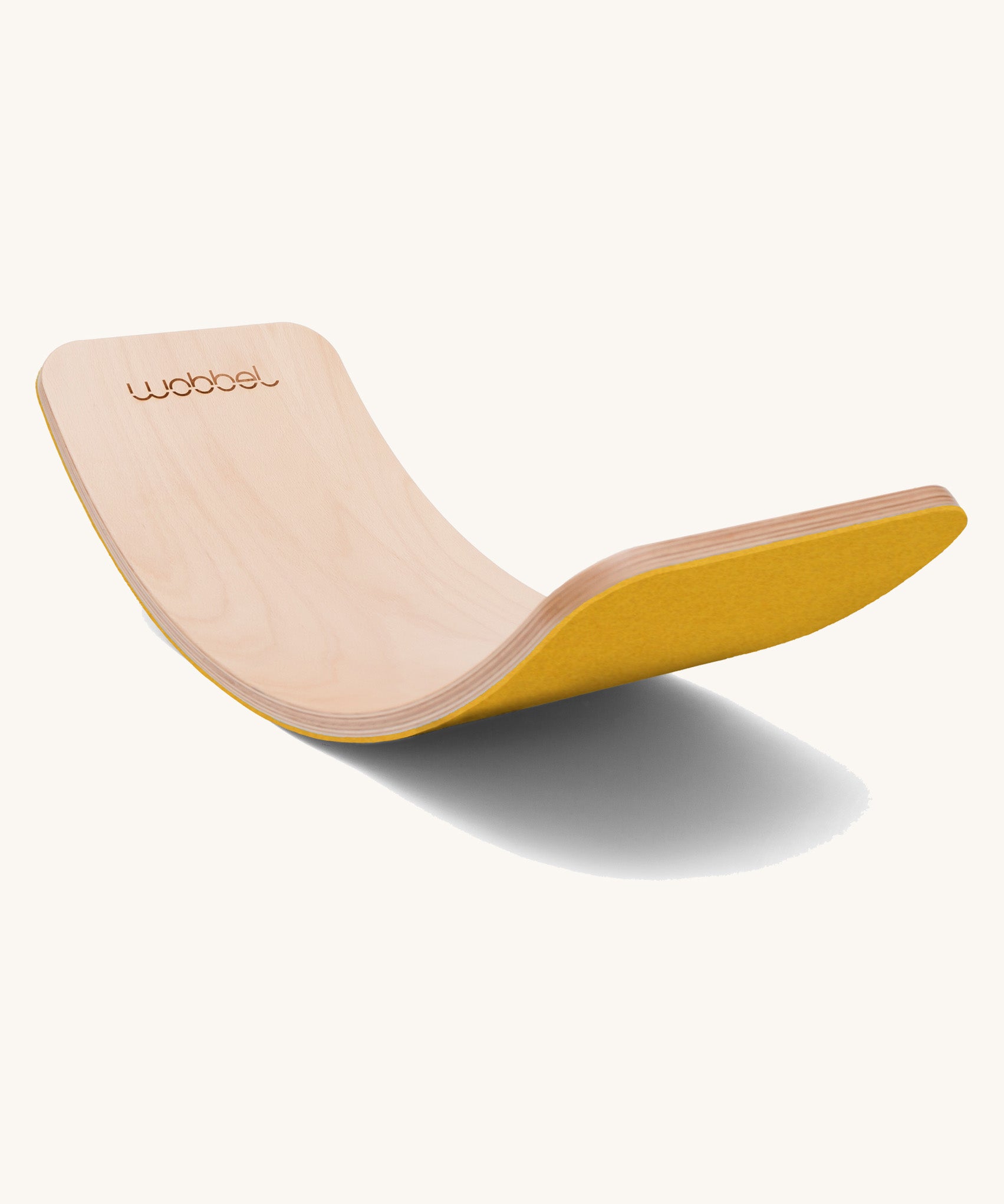 Wobbel Original beech balance board with mustard recycled felt base displayed in curved profile