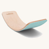 Wobbel Original beech balance board with sky blue recycled felt base shown on a plain background.