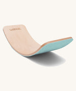 Wobbel Original beech balance board with sky blue recycled felt base shown on a plain background.