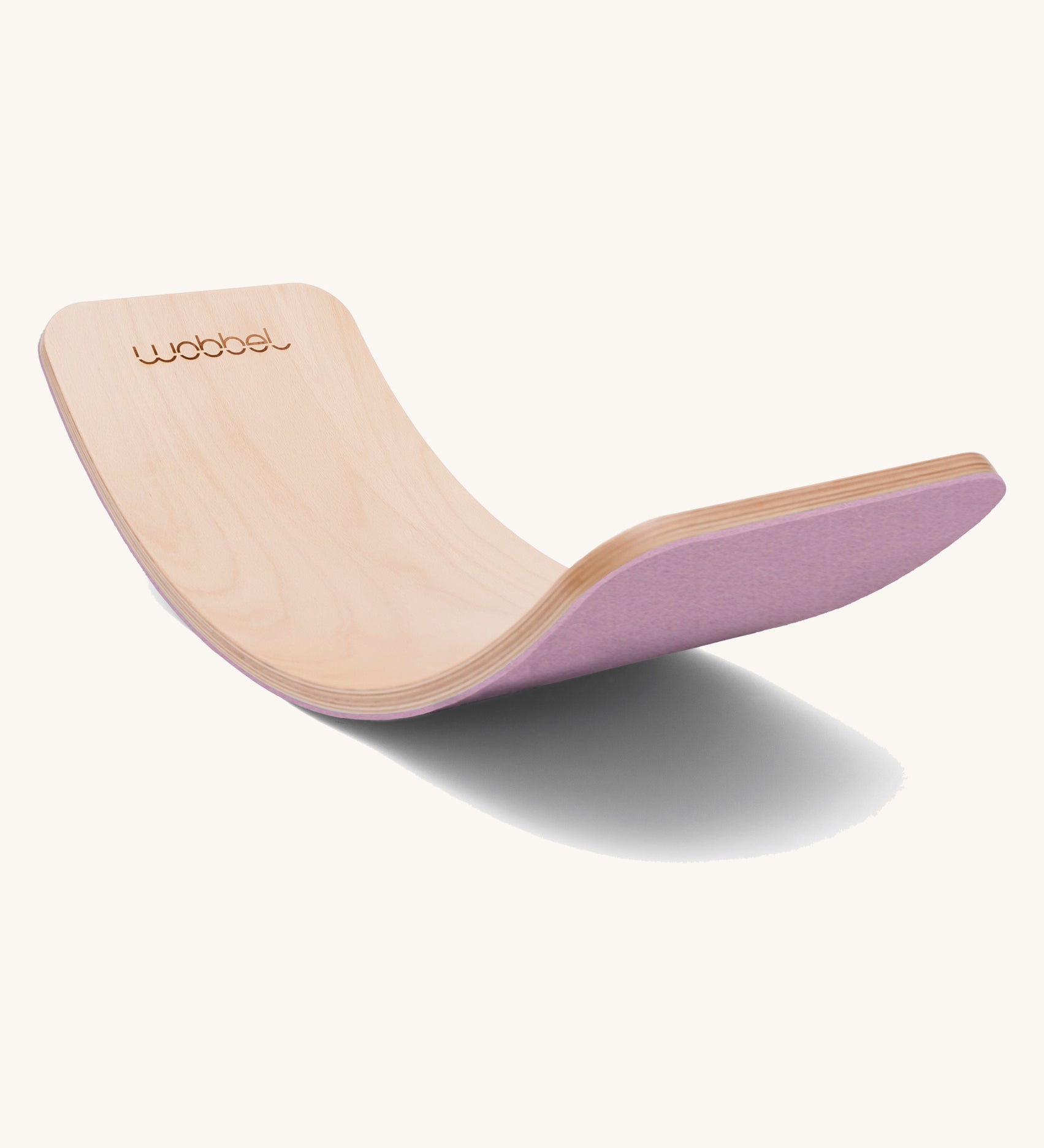 Wobbel Original beech balance board with wild rose recycled felt backing shown in a soft curve.