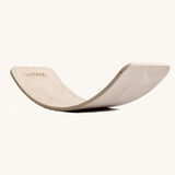 Wobbel Original Pure balance board in unlacquered FSC beech wood on a plain background