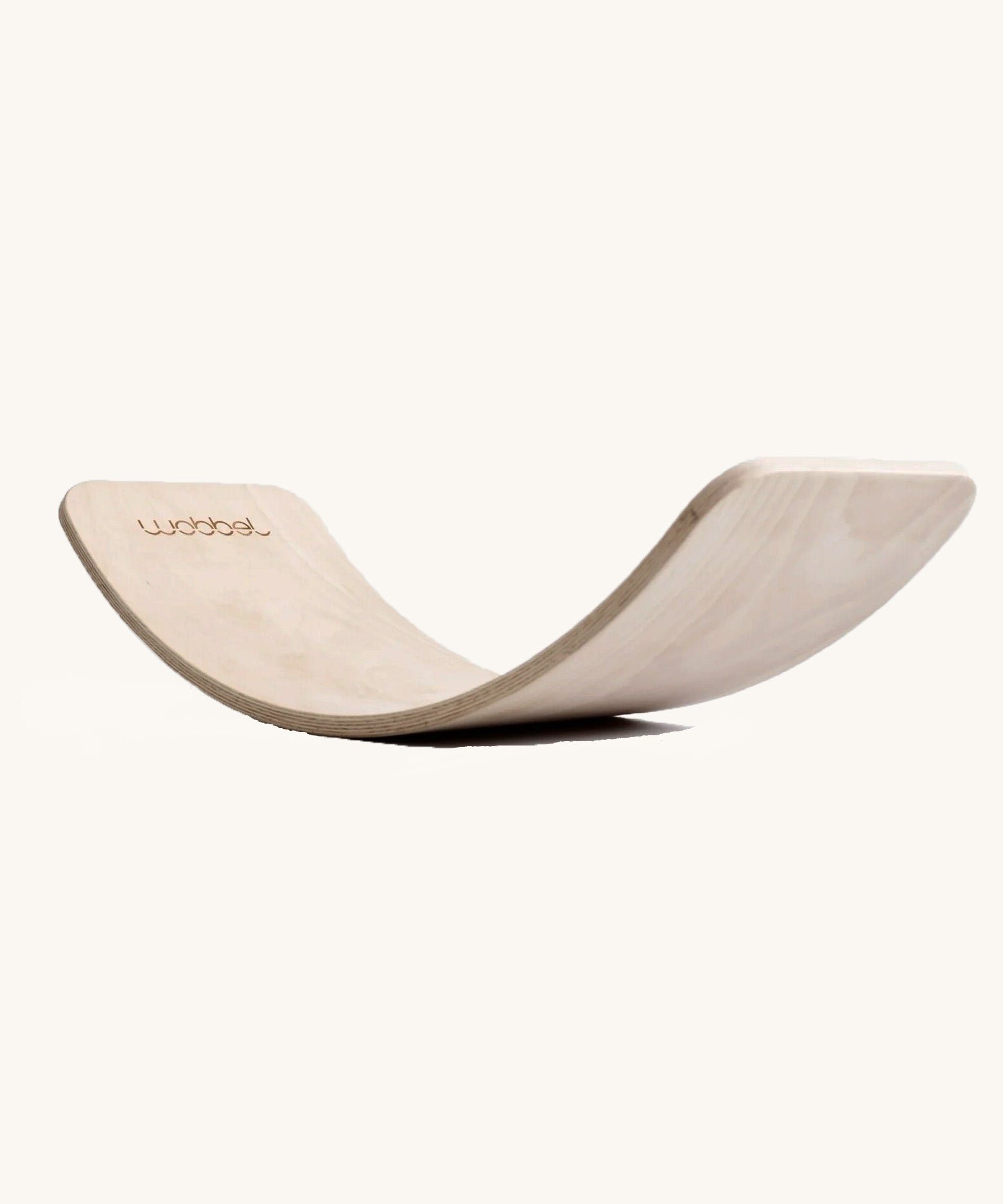 Wobbel Original Pure balance board in unlacquered FSC beech wood on a plain background