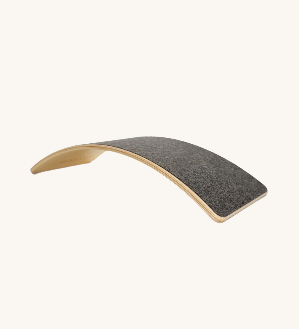 The Wobbel Board Starter, the smallest of the range, with grey felt in a colour called 'Into the Woods'.