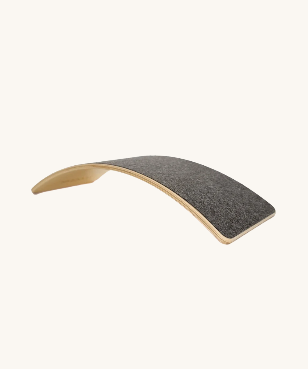 The Wobbel Board Starter, the smallest of the range, with grey felt in a colour called 'Into the Woods'.