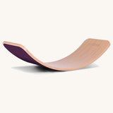 Wobbel Original beech balance board with aubergine wool felt backing on a plain background
