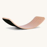 Wobbel Original beech balance board with black wool felt base shown side-on