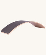 Wobbel XL beech wood balance board with mouse grey wool felt backing, shown in flipped curve position.