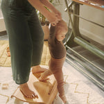 Woman and child stood on a Wobbel curved wooden Sup balance board