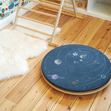 Wobbel 360 eco-friendly deck and pillow cushion accessories on a Wobbel balance board on a wooden floor