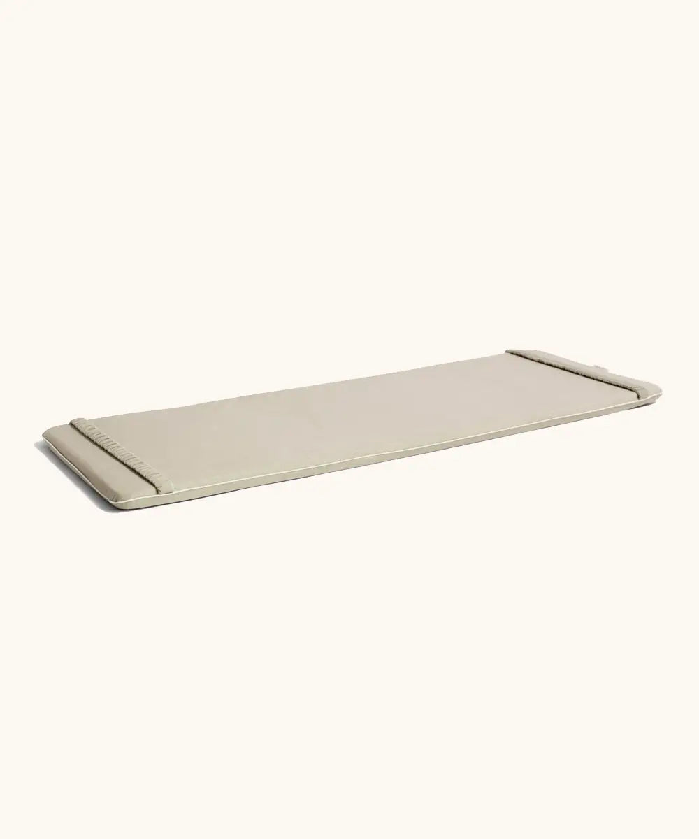 A oatmeal XL Wobbel deck laid flat showing elasticated loops on each end 