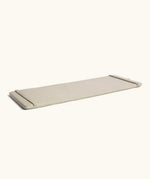 A oatmeal XL Wobbel deck laid flat showing elasticated loops on each end 