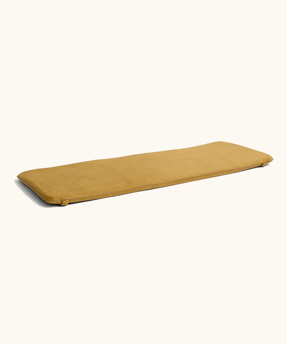 A ochre XL Wobbel deck laid flat showing elasticated loops on each end 