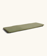 A olive green XL Wobbel deck laid flat showing elasticated loops on each end 