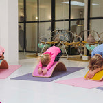 Group of children using Wobbel Beech Wood balance boards for yoga
