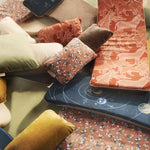 Wobbel balance board deck cushions and pillows scattered on the floor