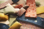 Wobbel balance board deck cushions and pillows scattered on the floor