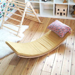 Wobbel eco-friendly deck and pillow cushion accessories on a Wobbel XL balance board on a wooden floor