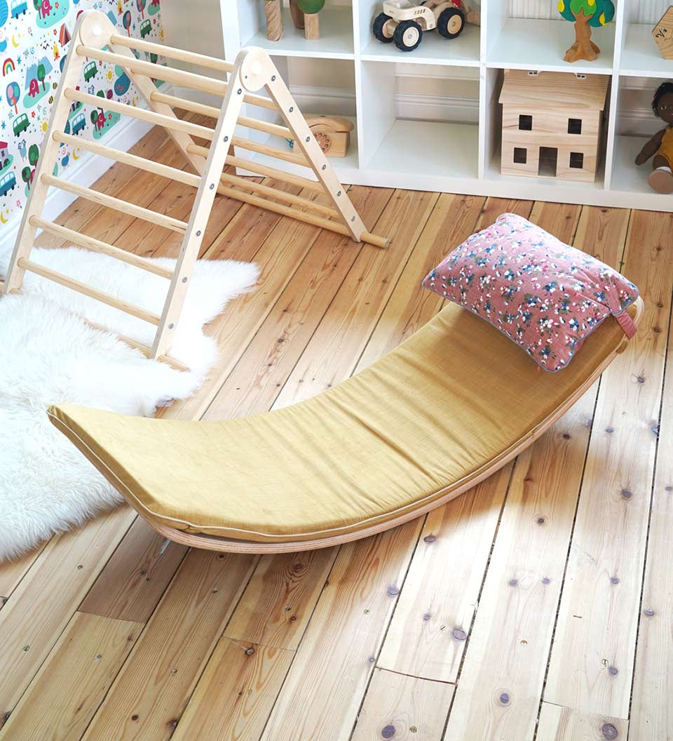 Wobbel eco-friendly deck and pillow cushion accessories on a Wobbel XL balance board on a wooden floor