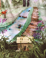 Wondercloths walk in the forest plastic-free play silk hanging up behind a wicker dolls house and some long grass