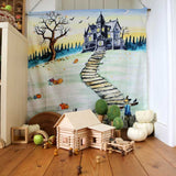Wondercloths Halloween themed organic cotton play cloth hung up by the side of shelving full of various wooden toys