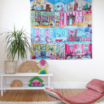The Wonderie Sensory Play Cloth - Welcome To The Doll House displayed on a wall to show to imagery. This busy scene shows an open dolls house