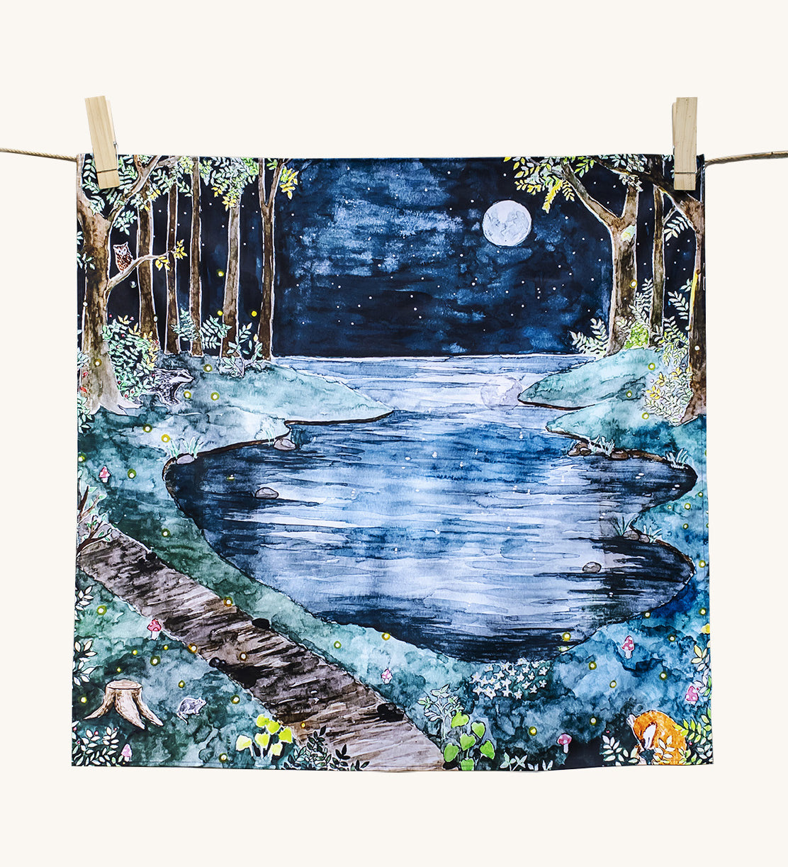 Wonderie Play Cloth featuring the moonlight forest design. Hand illustrated  theme drawings featuring a forest beside a lake underneath a moonlit sky.