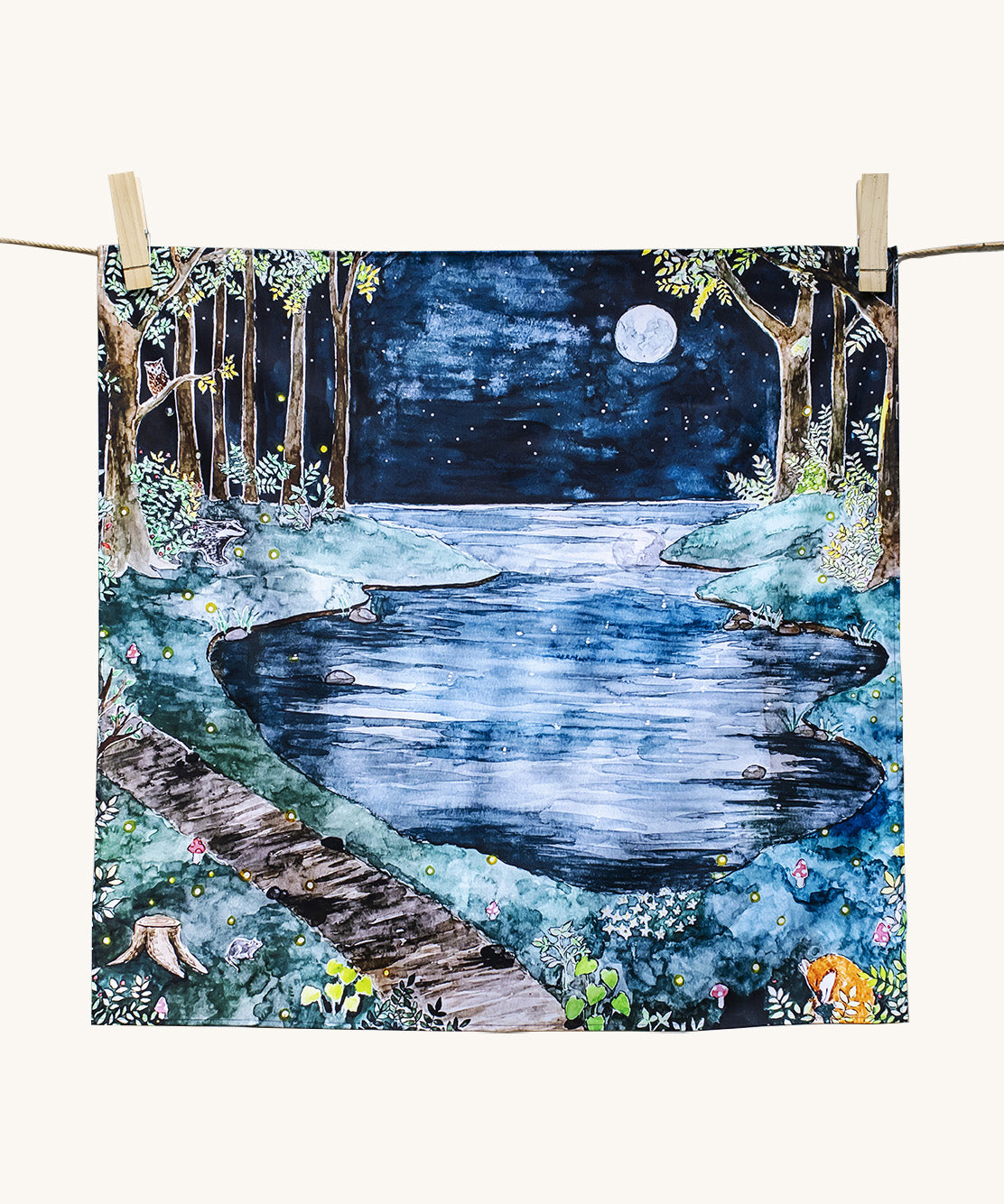Wonderie Play Cloth featuring the moonlight forest design. Hand illustrated  theme drawings featuring a forest beside a lake underneath a moonlit sky.