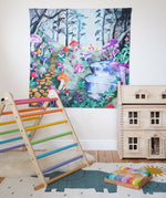 Wonderie Play Cloth with a Enchanted Toadstool Forest design hung up in a playroom surrounded by toys. 
