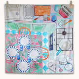 Wonderie Sensory Play Cloth - Around The Kitchen. Looking down on a busy kitchen scene, this play cloth shows a kitchen table with plates and cutlery, a cooking hob, chopping board, sink, toaster and pots and pans.