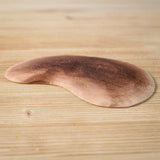 Bumbu Toys Wooden Little Island on a wooden surface.
