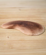 Bumbu Toys Wooden Little Island on a wooden surface.