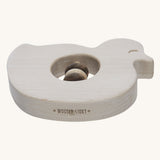 Wooden Story Baby Duck Rattle on a plain background. The rattle has been pictured from the side the Wooden Story logo can be seen etched onto the edge. 