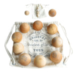 Wooden Story Boules set. The set contains the wooden boules balls and a smaller target ball, called cochonnet or jack. 