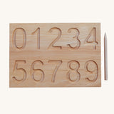 The number side of the Wooden Story Number Tracking Board with the wooden pencil next to it on a plain background. 