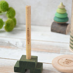 The central pole from the Wooden Story Stacking Toy Stick Figure. 