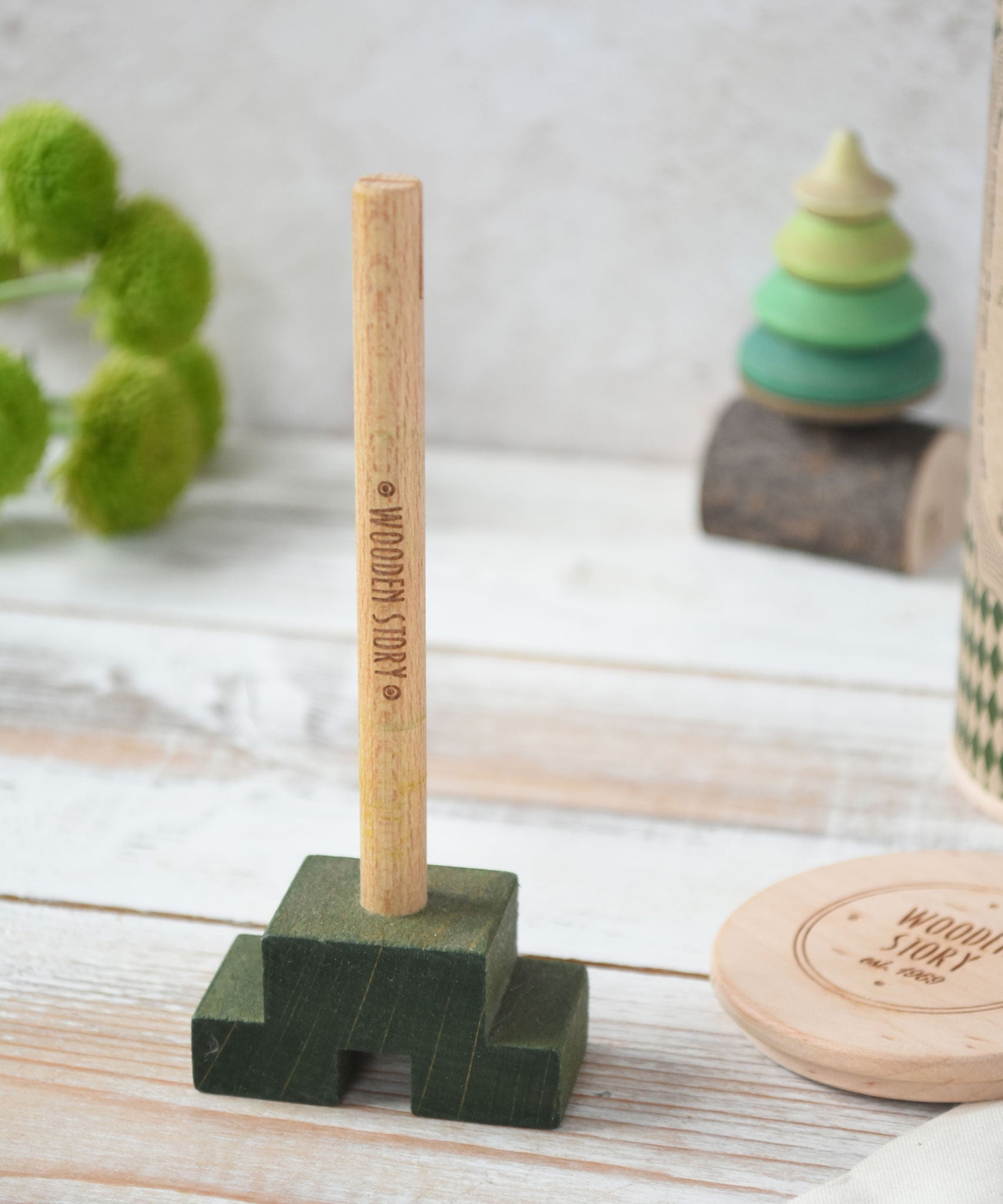 The central pole from the Wooden Story Stacking Toy Stick Figure. 