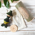 Wooden Story Stacking Toy Stick Figure - No7, a green stacking wooden figure wearing a hat. 
