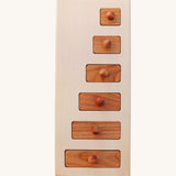 Wooden Story Montessori Long-Short wooden Knob Puzzle Toy. A wooden puzzle including a base frame and 5 rectangular shaped pieces in different lengths with round wooden knobs.  